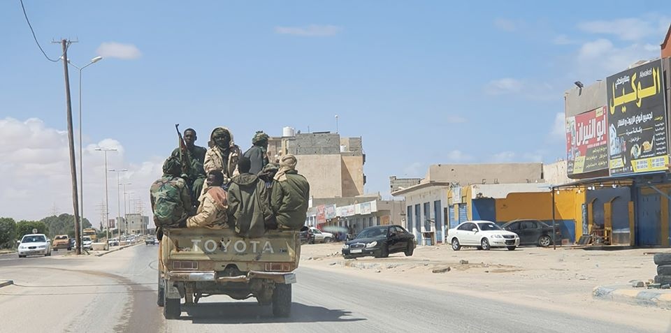 Sudanese mercenaries ride on a pickup truck in the city of Sirte Sudanese mercenaries ride on a pickup truck in the city of Sirte